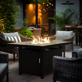 Lifestyle image of Aluminum Propane 48" Rectangle Outdoor Fire Pit Table styled in a cozy outdoor space, perfect for entertaining or dining with warmth and ambiance, Oakville, ON.