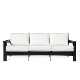 Hickory Polymer Outdoor Loveseat with Sunbrella® Canvas White cushions and black frame, stylish coastal design in Oakville, ON