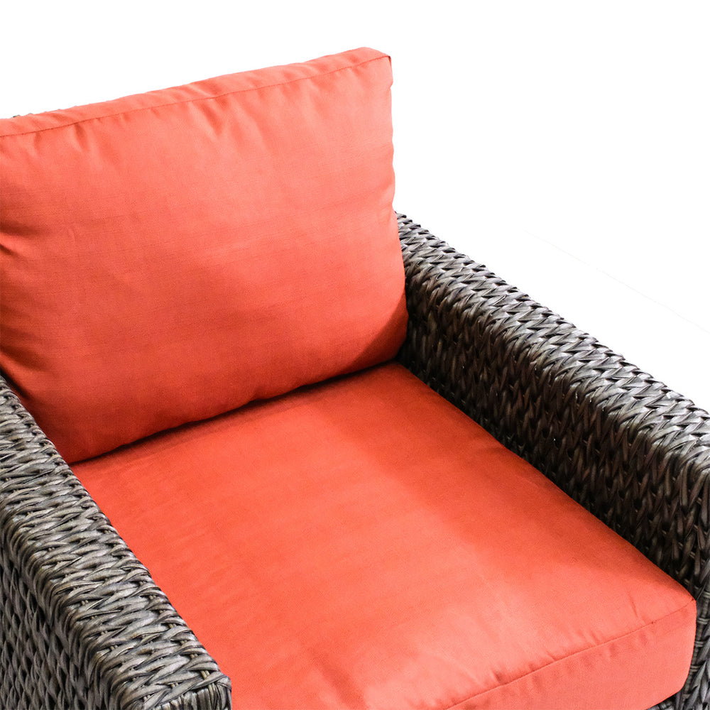 Close-up of Laguna Point Wicker Outdoor Club Chair from upper corner, highlighting deep seating and vibrant cushions in Toronto.