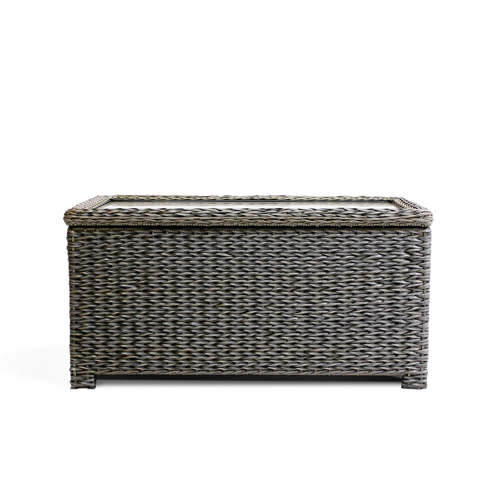 Front view of Laguna Point coffee table with wicker design, tempered glass top, and soft-close hinge for easy storage.