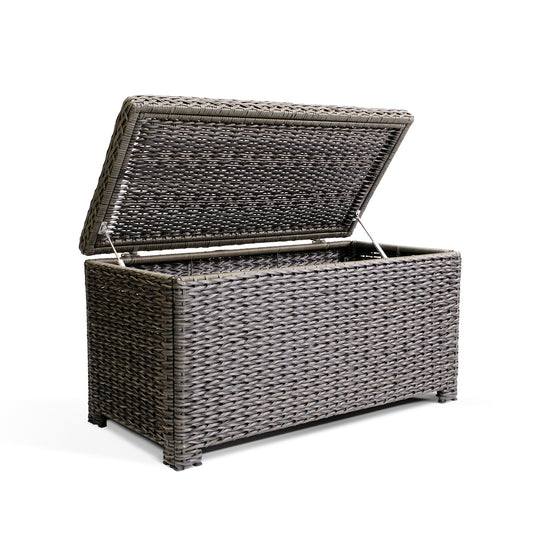 Resilient, all-weather resin wicker coffee table with soft-close hinges, tempered glass top, and ample storage space for blankets and pillows