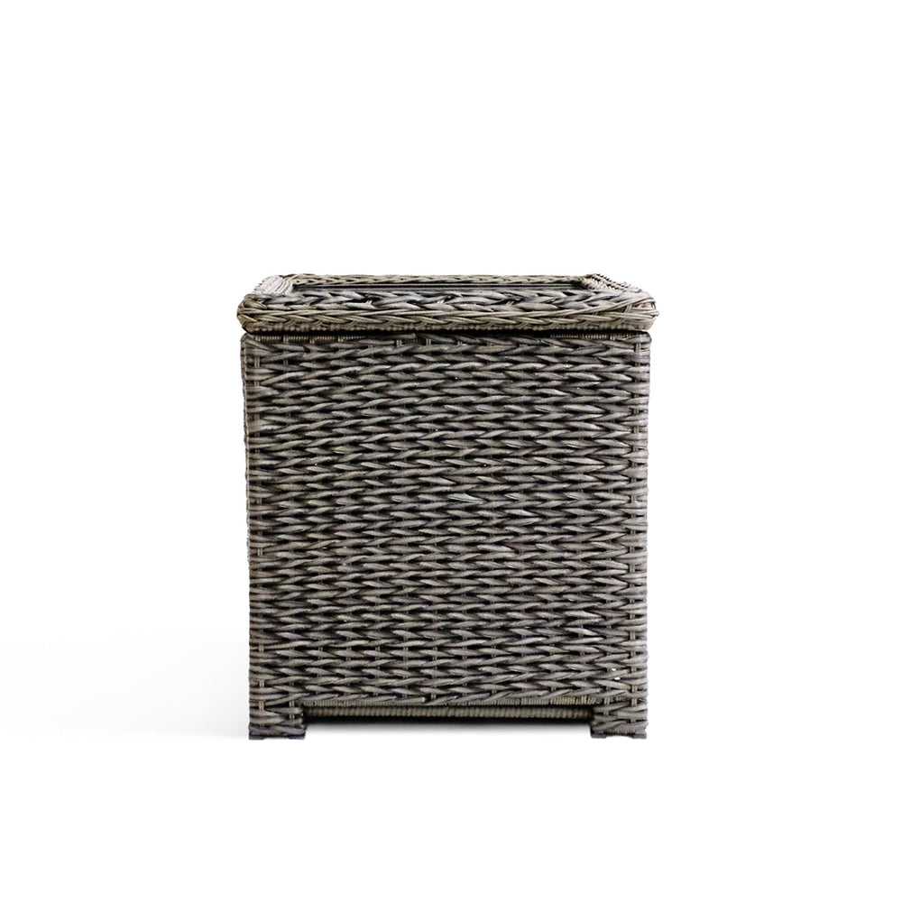 Front view of the Laguna Point end table with open lid, featuring the all-weather resin wicker frame and tempered glass top.