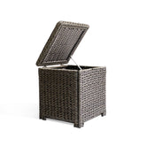 Side view of the Laguna Point end table with open lid, showcasing the resilient wicker frame and tempered glass top.