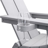 Close-up of the gray Adirondack chair's cupholder with a white glass, showcasing the detailed design.