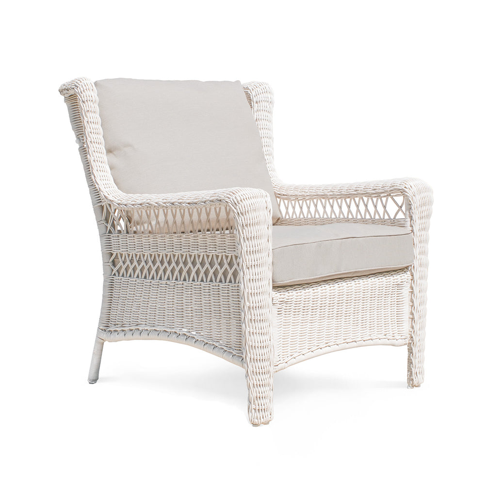Park Meadows Wicker Outdoor Club Chair shown from right corner side, full view showcasing the white cream finish, diamond weave details, and wide arms. Oakville, ON.