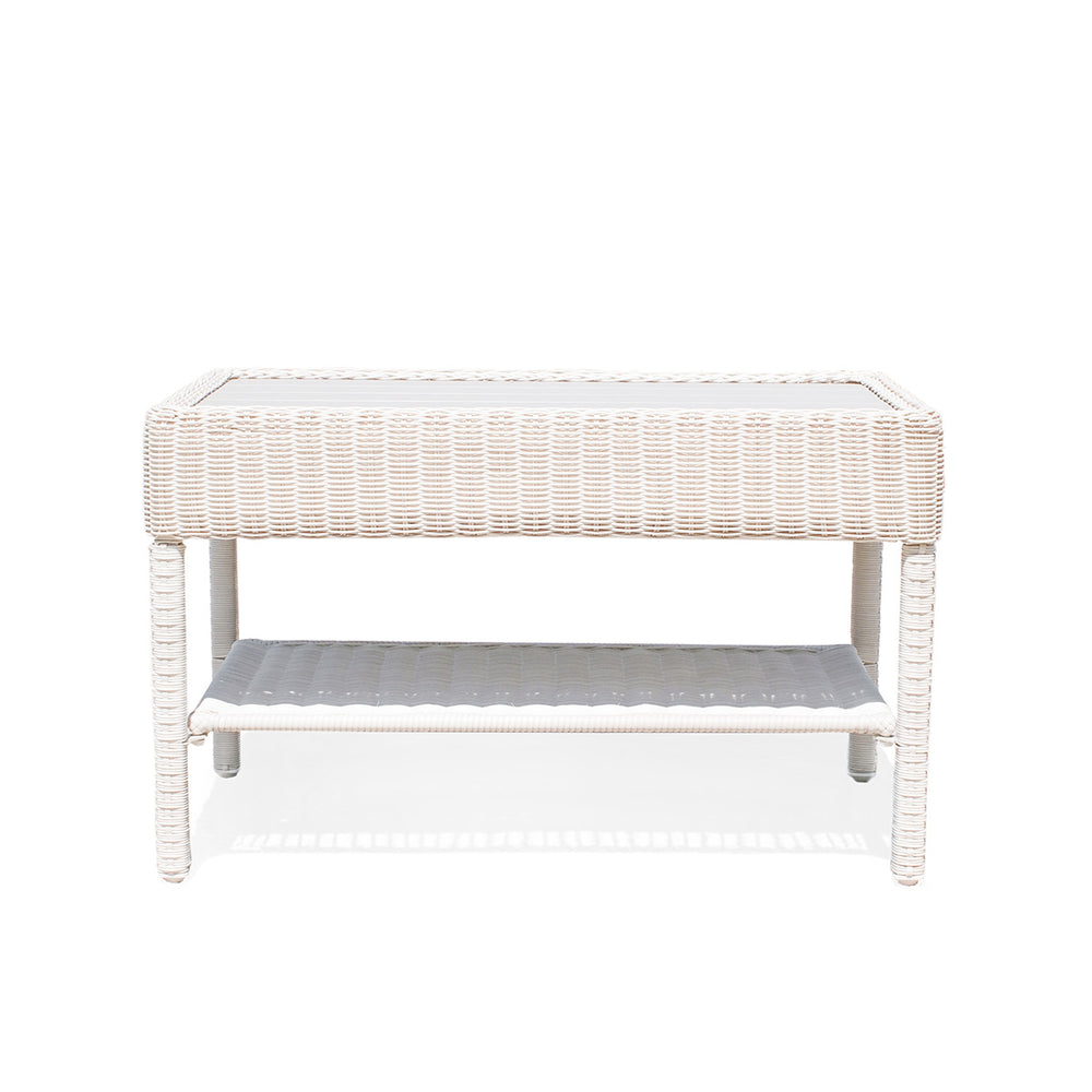 Park Meadows Wicker Outdoor Coffee Table in white cream finish with slatted top, built-in shelf, and robust resin wicker. Perfect for outdoor spaces in Oakville, ON.
