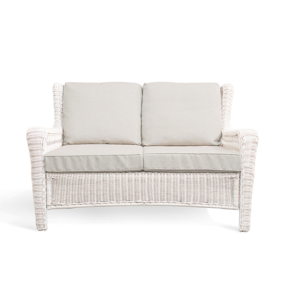 Park Meadows Wicker Outdoor Loveseat with plush cushions and diamond weave details, outdoor setting in Oakville, ON.