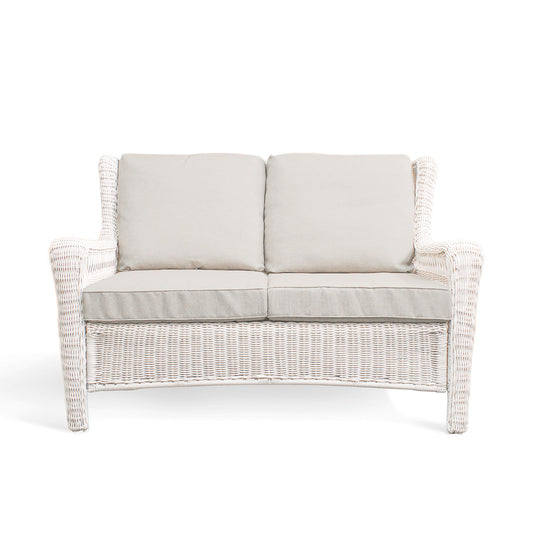 Park Meadows Wicker Outdoor Loveseat with plush cushions and diamond weave details, outdoor setting in Oakville, ON.