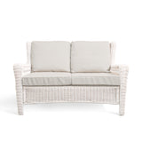 Park Meadows Wicker Outdoor Loveseat with plush cushions and diamond weave details, outdoor setting in Oakville, ON.