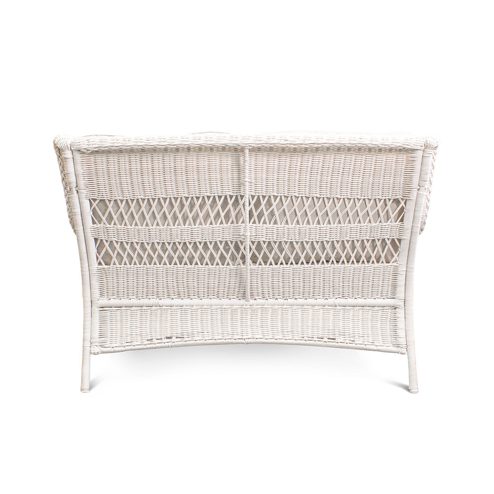 Backside view of Park Meadows Wicker Outdoor Loveseat showcasing diamond weave design and cushion details, outdoor setting in Oakville, ON.