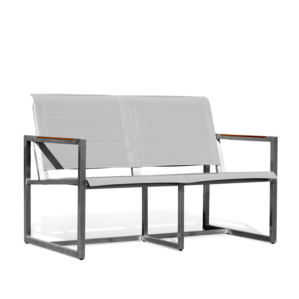 Side angle view of Pine Stainless Steel & Teak Outdoor Sling Loveseat showing a minimalist design with stainless steel framing, teak accents, and ergonomic seating, Oakville, ON.