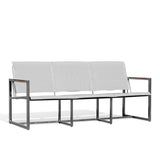 Side angle view of Pine Stainless Steel & Teak Outdoor Sling Sofa with slim profile, teak accents, and ergonomic Textilene seating, Oakville, ON.