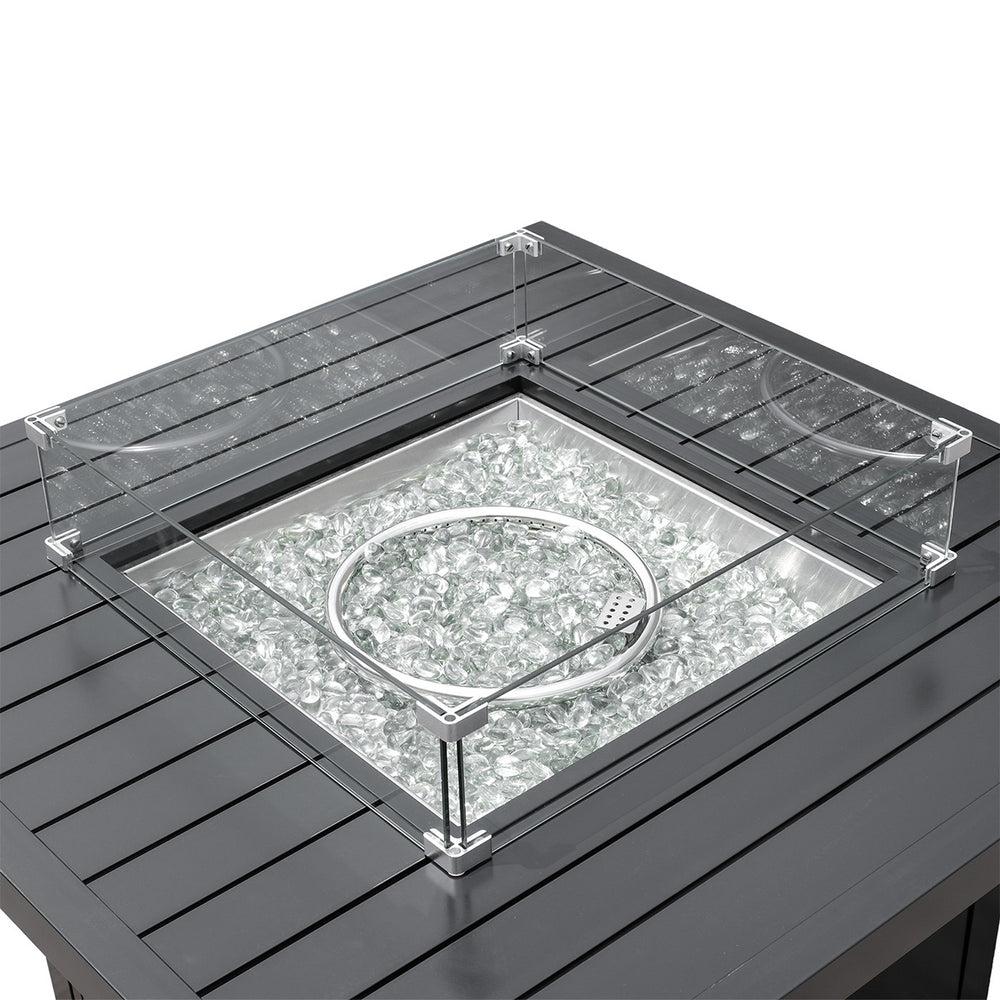 Close-up view of the burner and glass windguard on the square aluminum propane fire pit table, perfect for Oakville, Ontario outdoor spaces.
