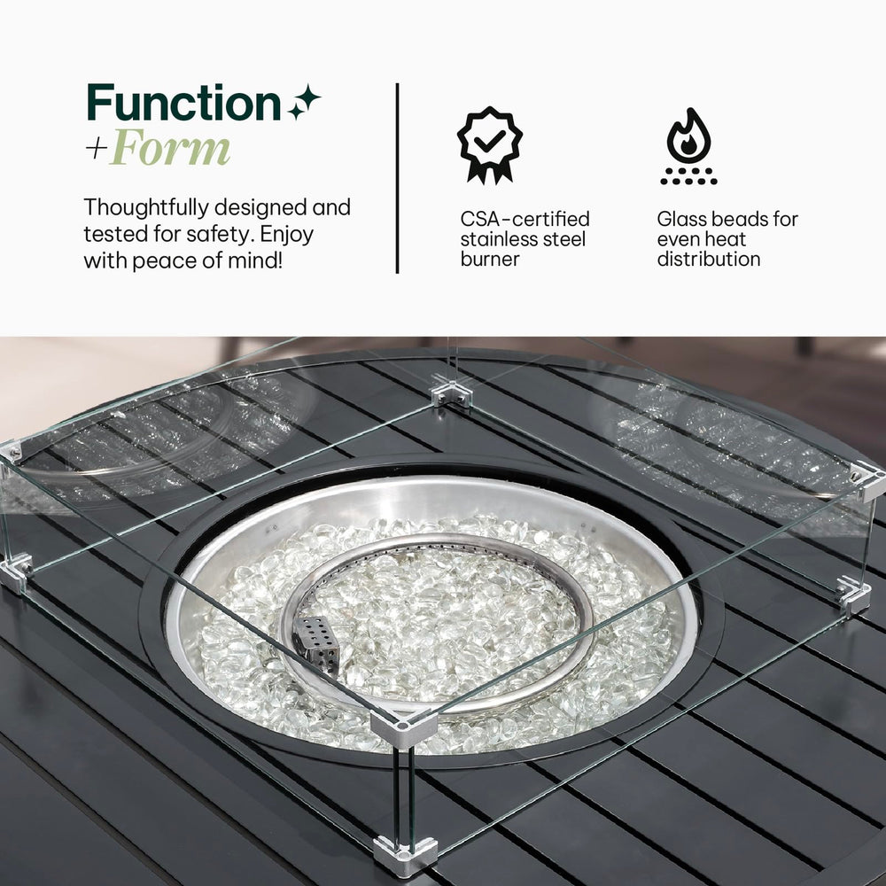 Close-up view of Aluminum Propane 42" Round Outdoor Fire Pit Table showcasing the heat-efficient glass beads and a durable glass windguard to maintain a steady flame, Oakville, ON.
