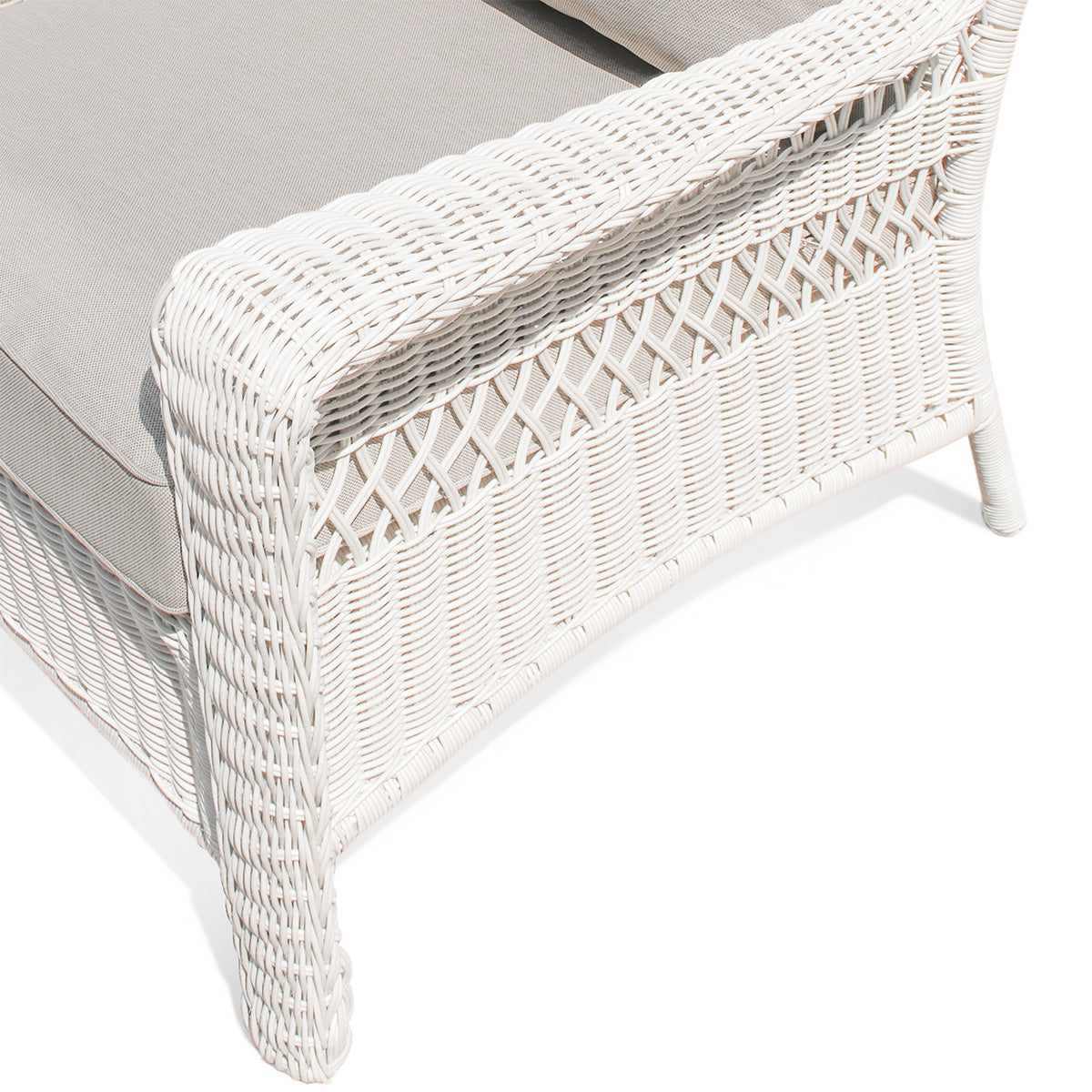 Close-up of the left armrest of Park Meadows Outdoor Chair, highlighting the detailed white cream wicker and plush cushion.