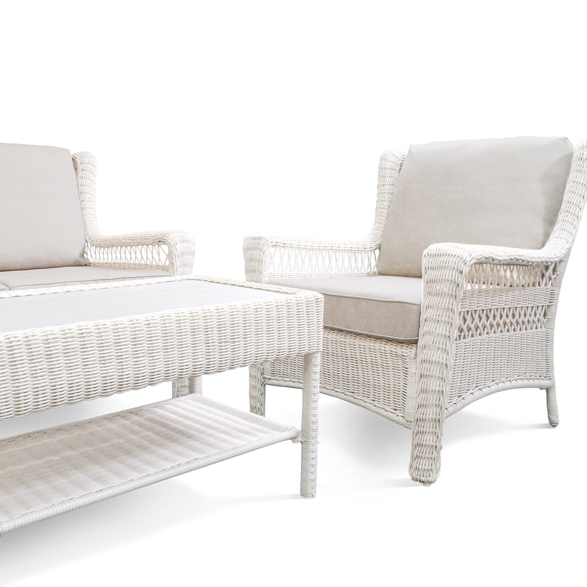 Park Meadows outdoor club chair and table corner with right armrest and left seat, showing wicker design and cushions in Oakville.