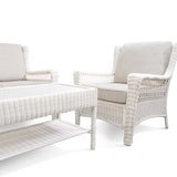 Park Meadows outdoor club chair and table corner with right armrest and left seat, showing wicker design and cushions in Oakville.